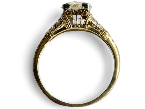  An American Early 20th Century Diamond Solitaire Ring with an Ornate Pierced Scroll Setting